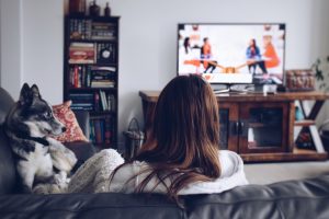 woman sheltering in place watching tv with dog five ways to protect yourself while sheltering in place article walnut creek california Kelley A Way attorney estate law