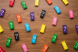 Colorful wooden blocks with a symbol of question marks for article Do I Need a Tax ID for my Trust by kelley way estate planning attorney walnut creek