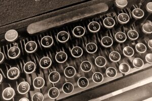 close up of keys on a vintage typrewriter for article by kelley way about estate planning for authors