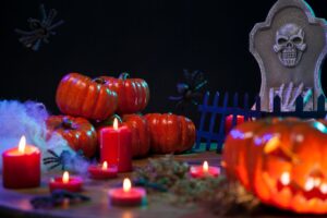 haunted pumpkins on halloween with burning candles as featured image for article by kelley way titled recent estate planning horror stories