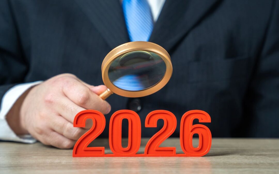 a man in a suit using a magnifying mirror to inspect numbers in red 2026 used as featured image in blog article by kelley a way why does copyright expire