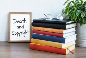 death and copyright written on a white board next to a stack of books and a house plant for blog article by kelley way titled What Happens to My Copyrights After I Die?