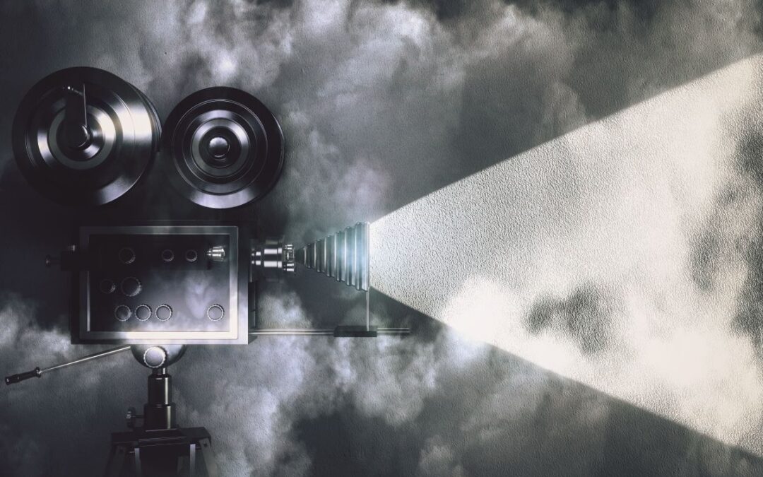 Classic Movie Camera Projecting Light in Fog for featured image in blog by kelley way titled celebrity estate planning horror stories 2026